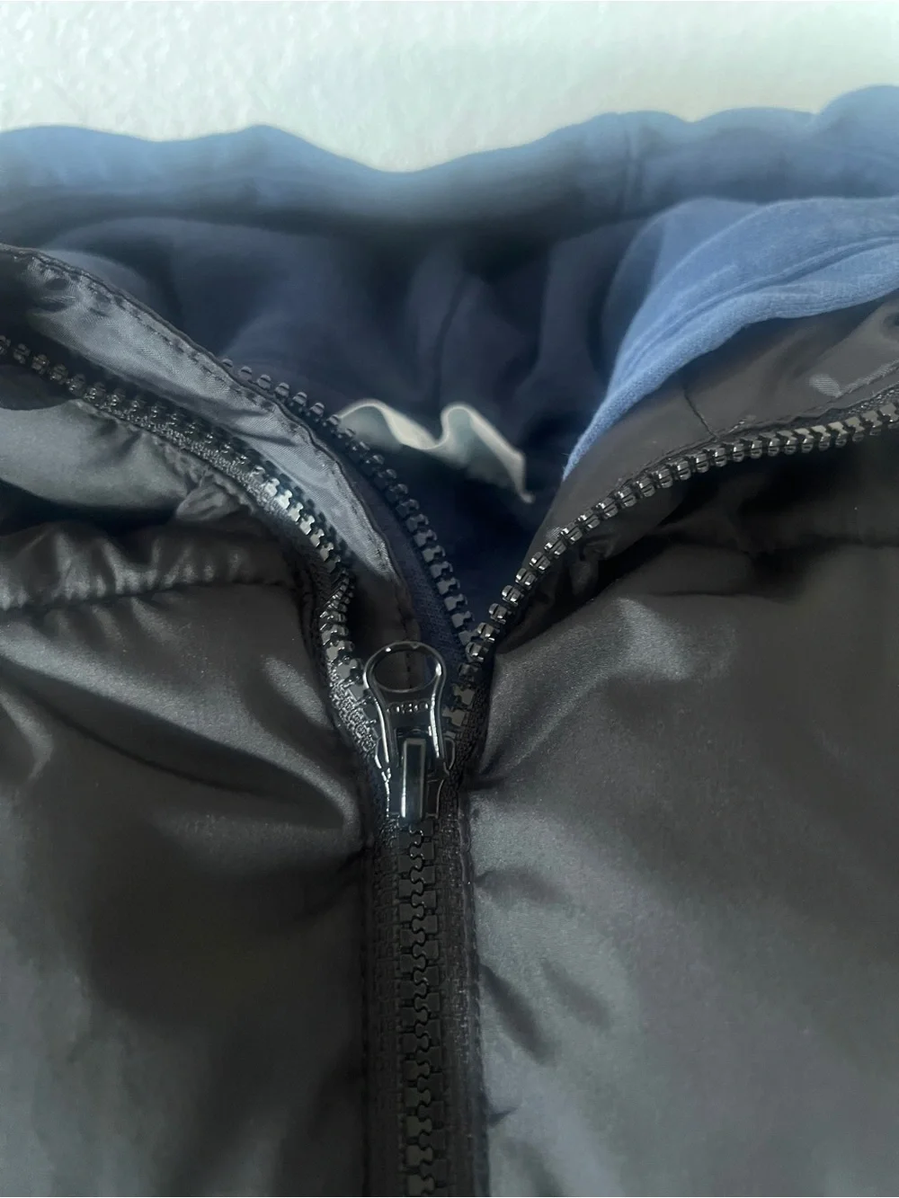 Old Navy Kids Black Puffer Vest with H&M Blue Hoodie together for a Layered Look